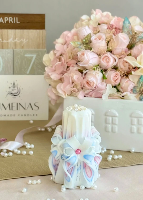 Hand-carved pastel candle in sky blue, pink, and white, finished with a pearl shine and presented in a gift box.