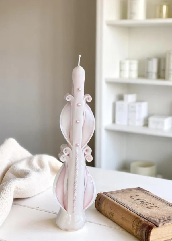 Hand-carved white vertical pillar candle made by artisans – elegant handmade piece for weddings and birthday celebrations.