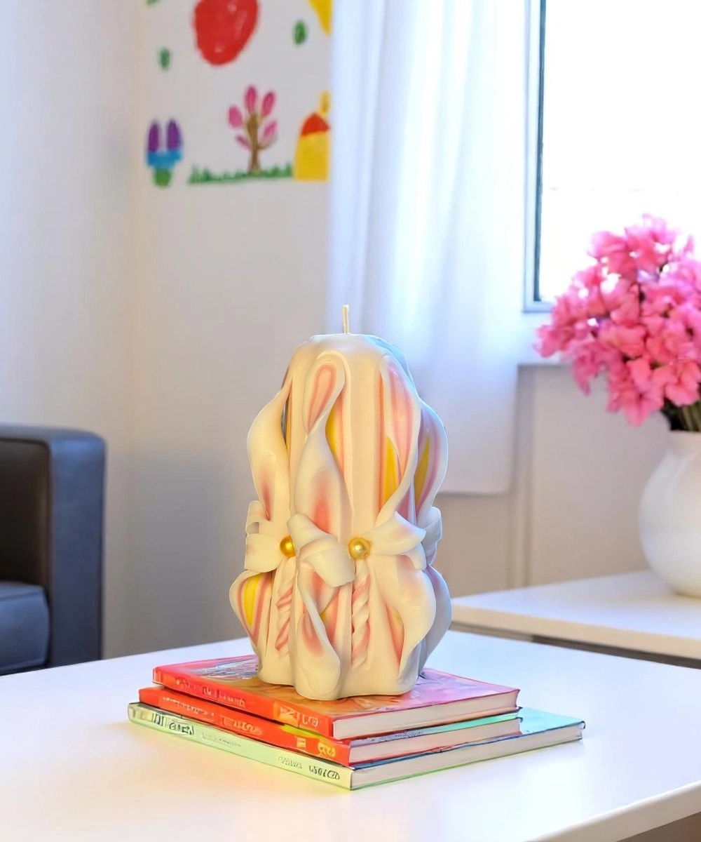 Luxury hand-carved candle in yellow, pink, and white paraffin wax by Lumeinas — unique artisan decorative gift candle