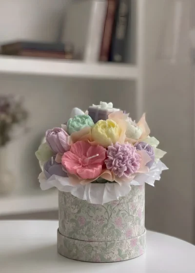 Pastel floral candle bouquet in a decorative round gift box with handmade wax peonies, dahlias and roses in pink, lavender, mint and yellow