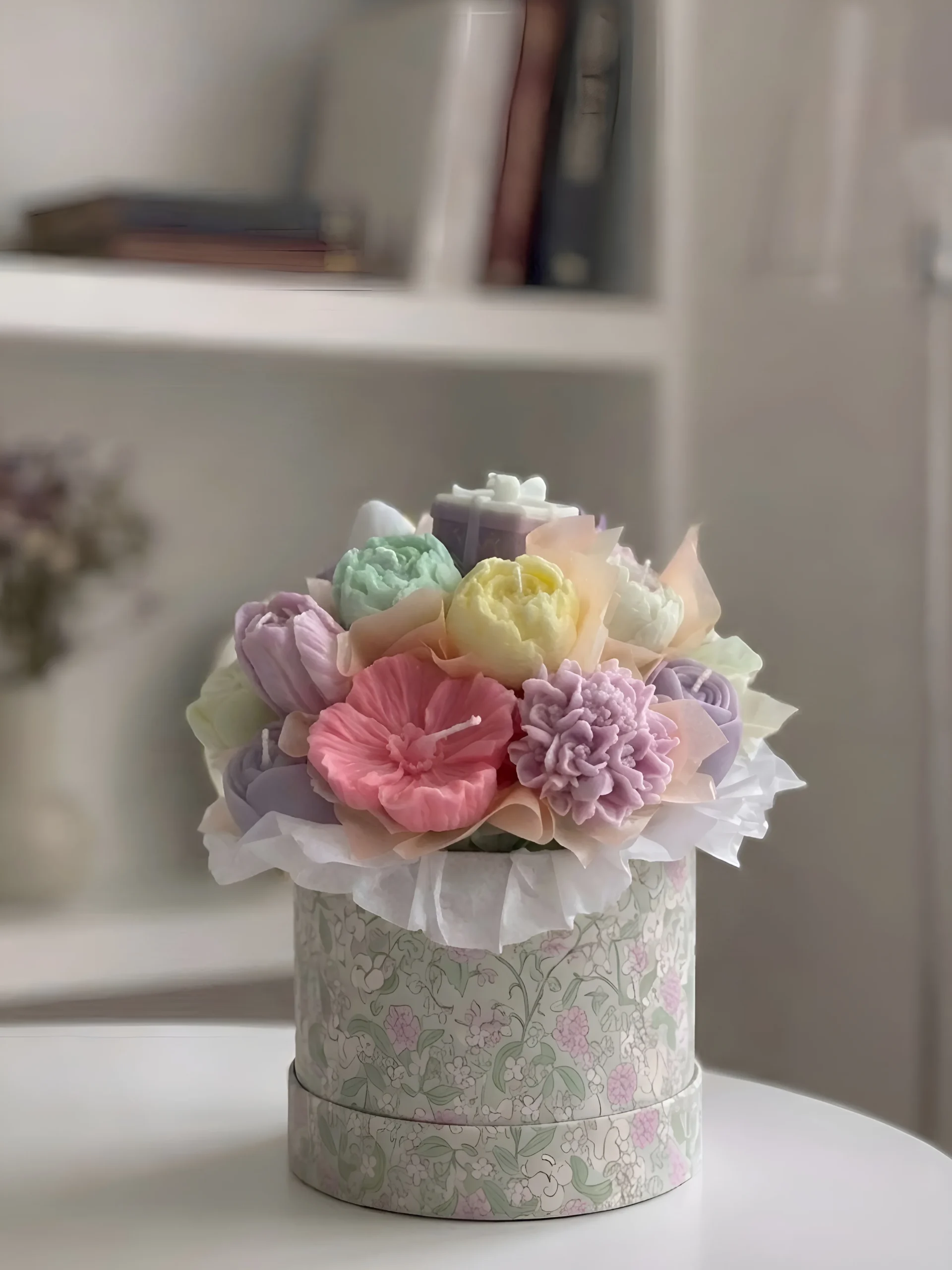 Pastel floral candle bouquet in a decorative round gift box with handmade wax peonies, dahlias and roses in pink, lavender, mint and yellow
